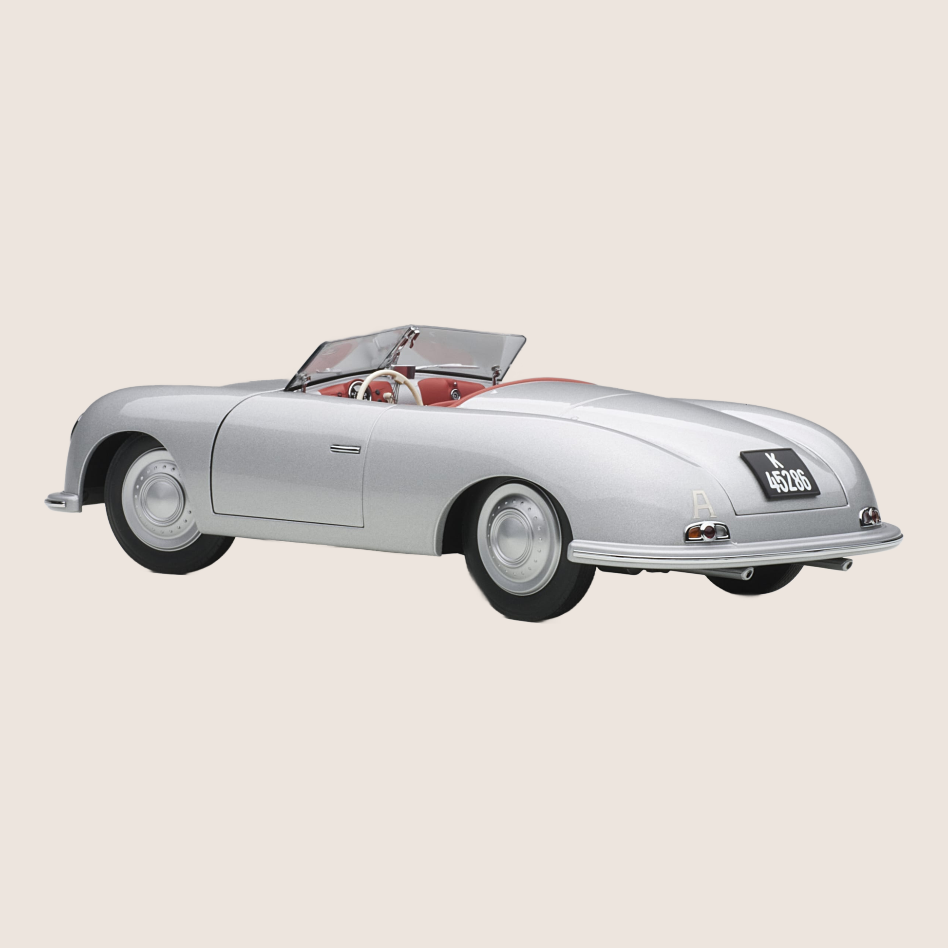 Porsche 356 modelbil i skala 1/18 fra AutoArt – en præcisionsfremstillet kopi af den ikoniske tyske sportsvogn fra 1948. Denne klassiske samlermodel har detaljeret interiør, bevægelige døre, motorhjelm og bagagerum, hvilket gør den perfekt til bilentusiaster og samlere af Porsche-modeller.