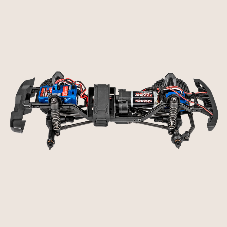 Traxxas TRX-4M Defender Blå – Kraftfuld fjernstyret bil i rød, designet til terrænkørsel og eventyr.