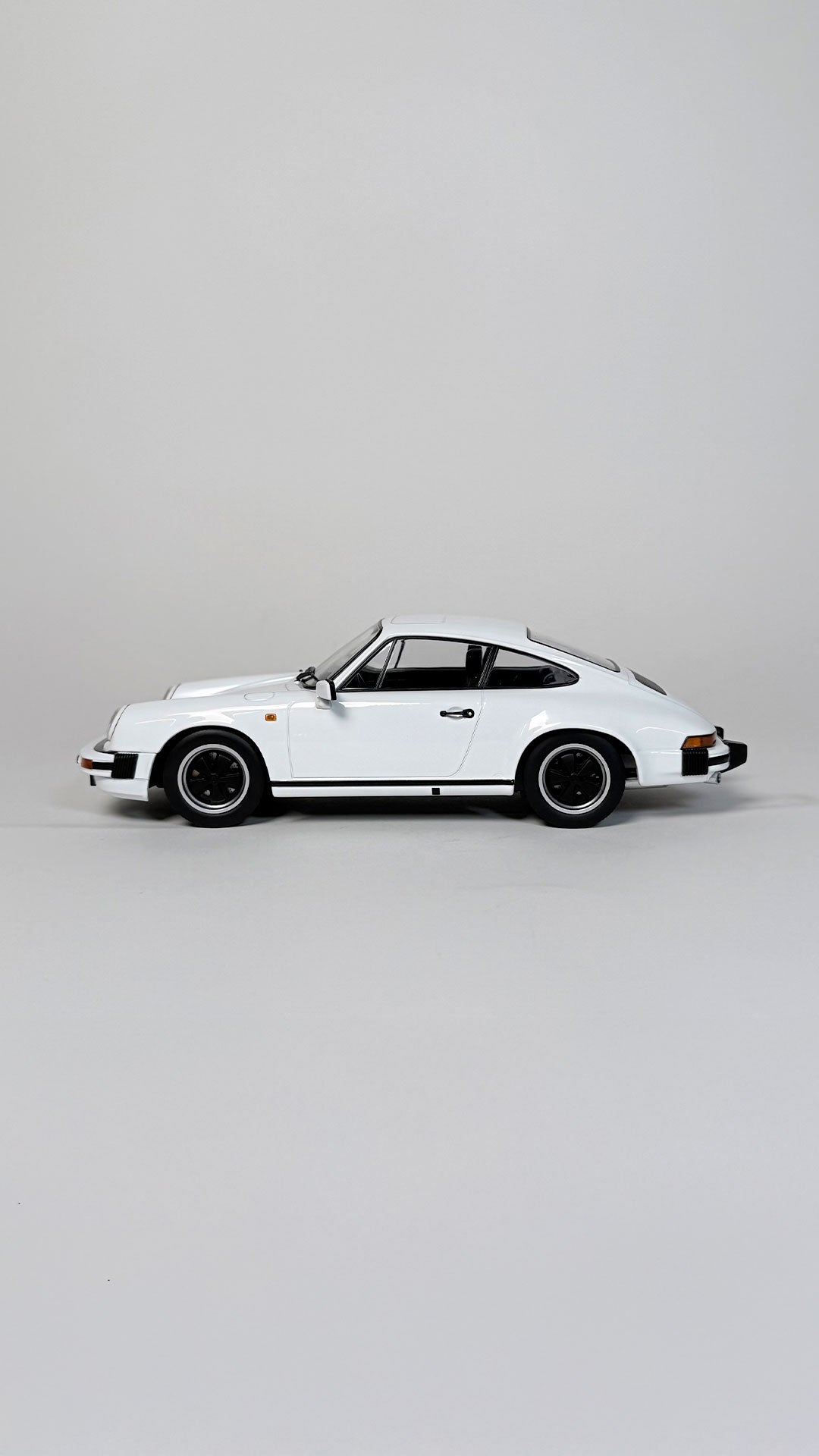 1983 Porsche 911 Carrera Coupé 1:18 scale model car in white