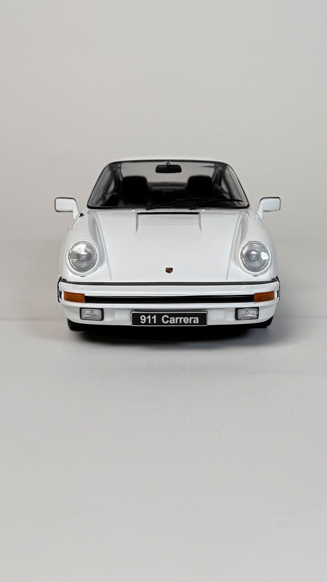 1983 Porsche 911 Carrera Coupé 1:18 scale model car in white
