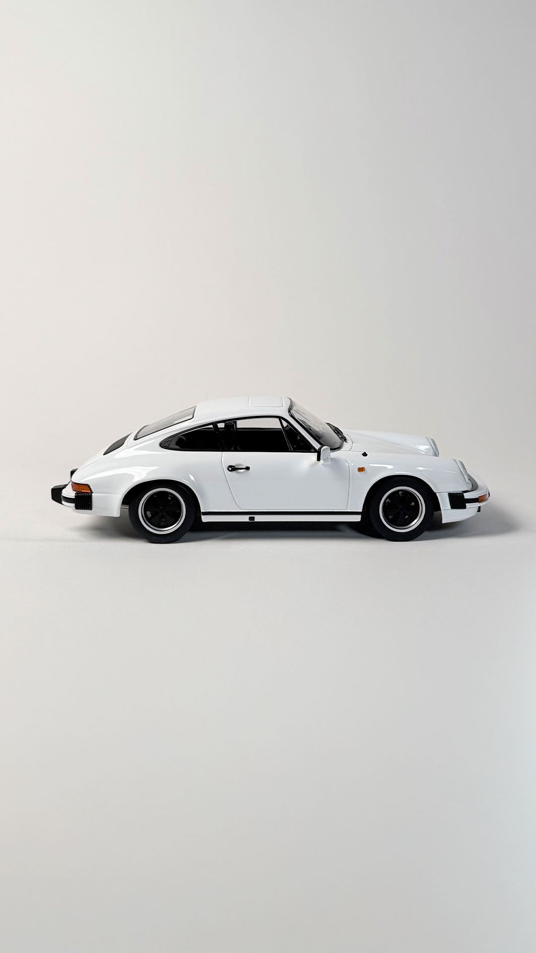 1983 Porsche 911 Carrera Coupé 1:18 scale model car in white