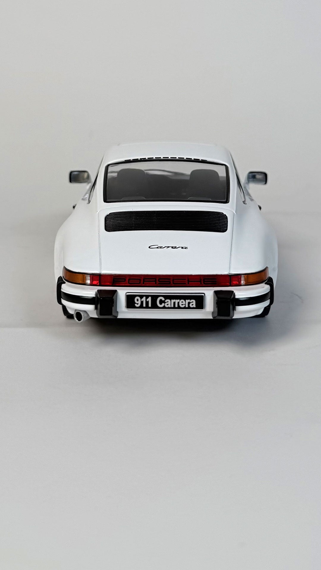 1983 Porsche 911 Carrera Coupé 1:18 scale model car in white