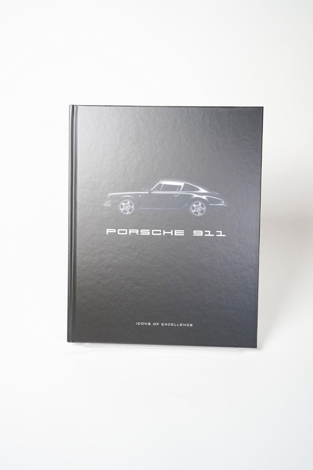 Bog “Porsche 911: Icons of Excellence” med billeder og information om klassiske og moderne Porsche 911-modeller