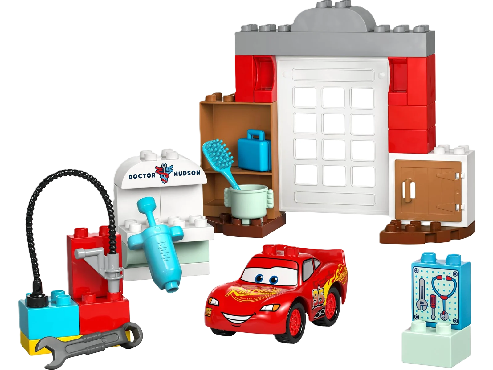 Lego Duplo “Lynet McQueen besøg i Docs værksted” – farverigt Duplo-sæt med Lynet McQueen og Doc Hudson i deres værksted. Perfekt til små bil-entusiaster og kreativ leg.